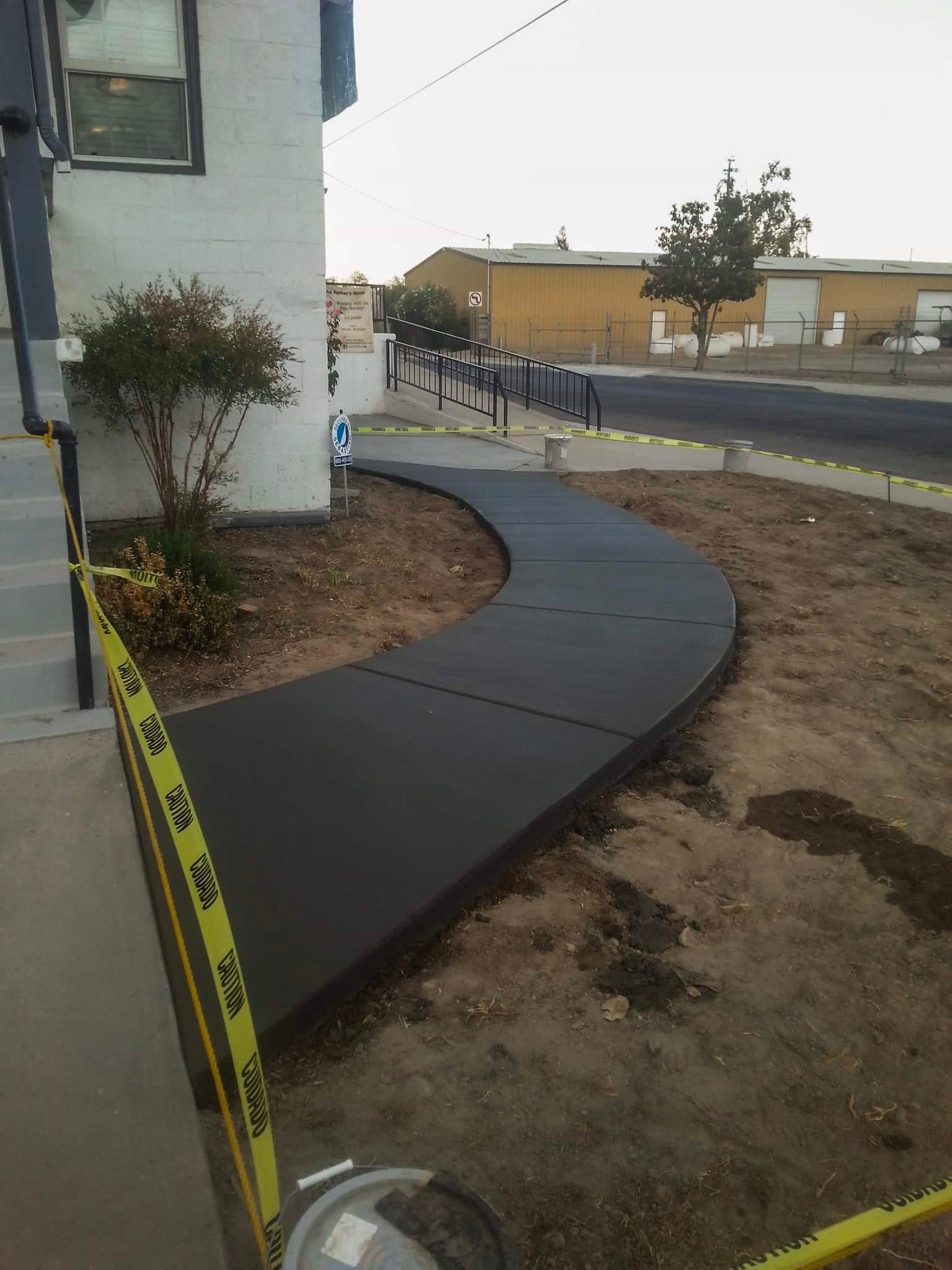 Finished concrete entry steps and landing